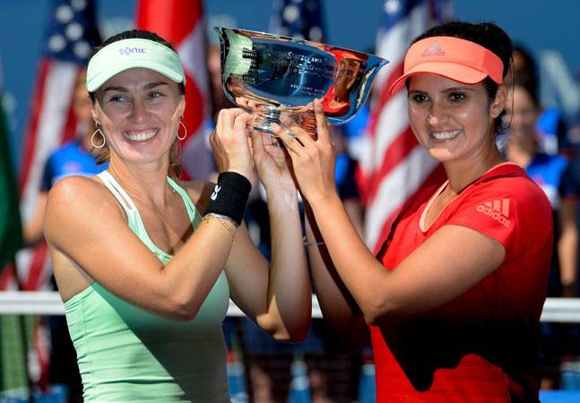Wimbledon champions Martina Hingis and Sania Mirza have captured their second consecutive Grand Slam women's doubles crown, defeating Casey Dellacqua and Yaroslava Shvedova 6-3, 6-3 in the US Open final. India's Mirza and Swiss veteran Hingis did not drop a set in becoming the first top-seeded duo to win the US Open women's doubles title since Cara Black and Liezel Huber won the 2008 crown. Hingis also won the mixed doubles alongside a partner from India, men's doubles veteran Leander Paes. It was the 11th career Grand Slam doubles title for Hingis, 34, who has won four Australian Opens (1997, 1998, 1999, 2002), two French Opens (1998, 2000), three at Wimbledon (1996, 1998, 2015) and two on the New York hardcourts in 1998 with Jana Novotna and this year.