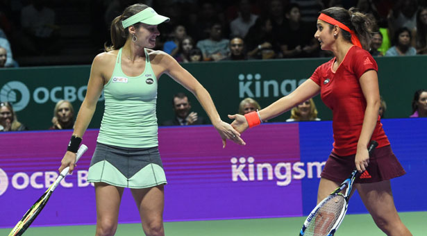 Swiss veteran Martina Hingis and India's Sania Mirza have crowned a stunning year for their partnership on Sunday by winning their ninth title at the WTA Finals in Singapore.The duo, crowned the best doubles team of the year, thrashed the Spanish pair of Garbine Muguruza and Carla Suarez Navarro to clinch the WTA Finals women's doubles trophy.Before this win,Sania and Martina have won eight titles (Indian Wells, Miami, Charleston, Wimbledon, US Open, Guangzhou, Wuhan and Beijing) and finished runner-up just once (Rome - falling to WTA Rising Stars Timea Babos and Kristina Mladenovic).